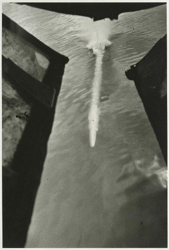 Torpedo emerges from the aircraft hatch