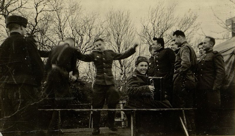 Image: Officers at an amateur performance evening celebrating the 27th anniversary of the October Revolution. Dancing Major Tsipurka com of the 3rd rifle battalion, the chief of reconnaissance of the regiment captain Tereshchenko (Norway, Sandnes)