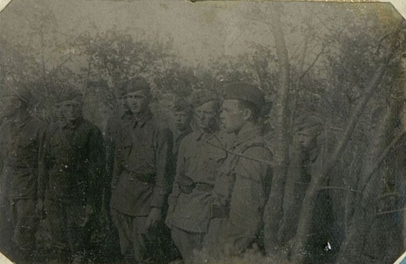 Image: Divisional Commissioner Volkov with a group of awardees. Summer 1942