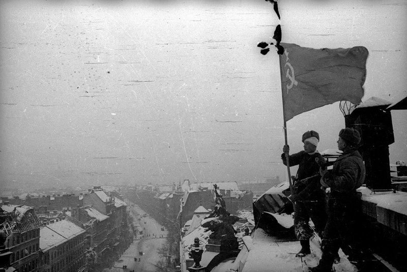 Soviet flag fluttering over Budapest on the roof of Parliament Building
