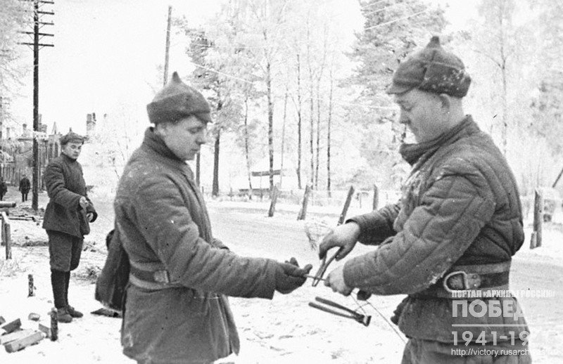 Field communications crewmen repairing telegraph line in Terijoki region  destroyed by Finns