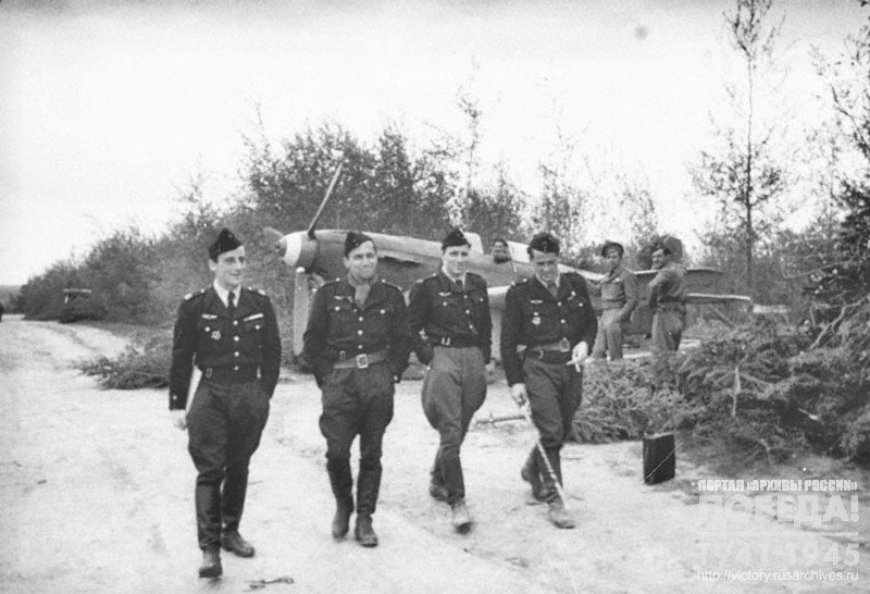 French pilots of the "Fighting France"  unit "Normandy" leave the airfield after completing a combat mission