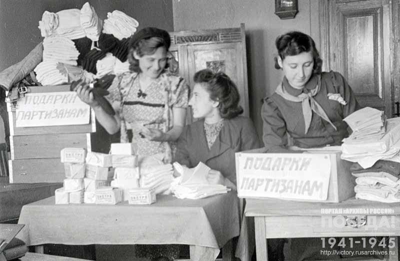Komsomol members of Saratov pack parcels with gifts to be sent to the Soviet partisans