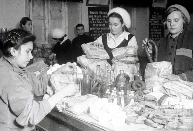 Female employees of one of the logistic terminal in Kolomna pack holiday gifts for front line soldiers