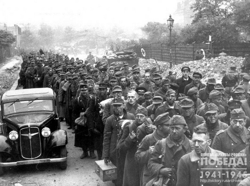 Columns of captured Germans passing along the streets of Berlin