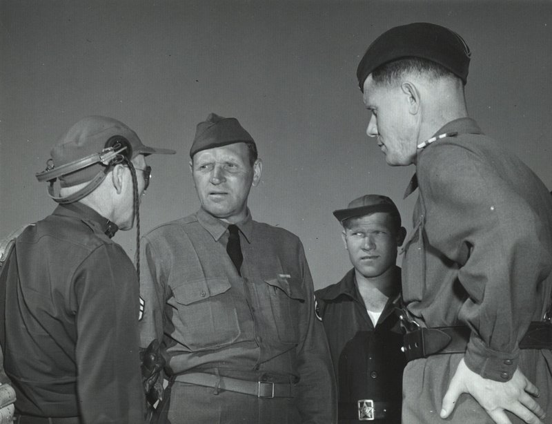 Soviet officer talking with American pilots