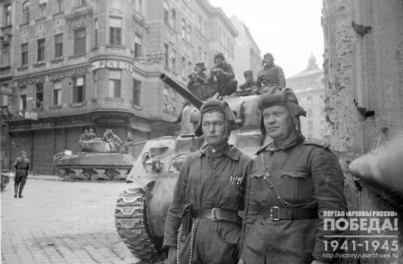 Crew of M4A2 Sherman tank that was the first to enter Vienna, with its commander