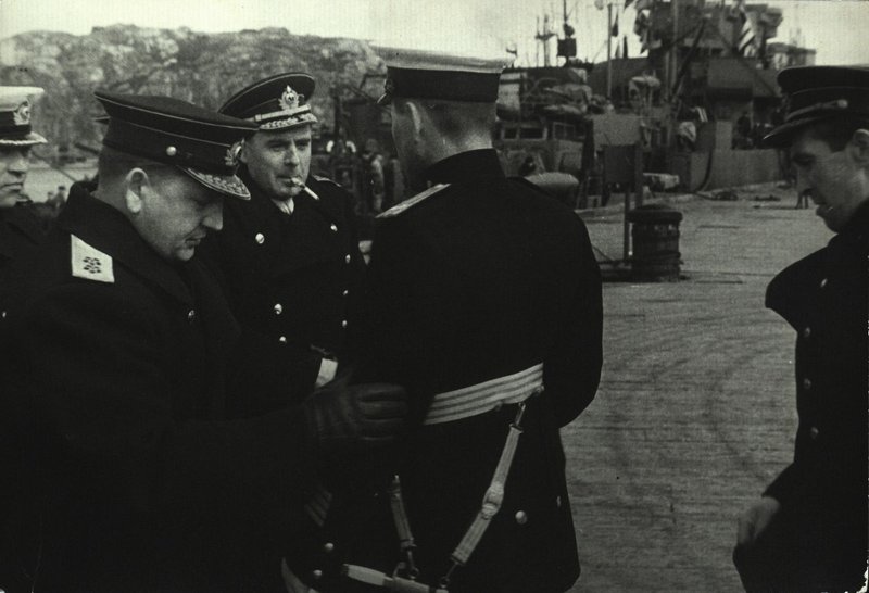 Commander-in-chief of the Northern Fleet Admiral A. Golovko and Member of the Military Council of the Northern Fleet A. Nikolaev checking the outfit of the Hero of the Soviet Union Captain of 2nd Rank S. Zyuzin departing for the Victory Parade
