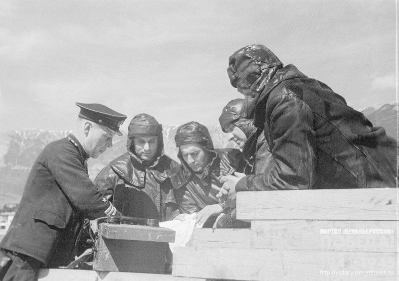Captain 3rd Rank V. Dovgay, First Lieutenant V. Lozitsky, First Lieutenant A. Kananadze and others analyzing the operation. Village of Simeiz, 1944