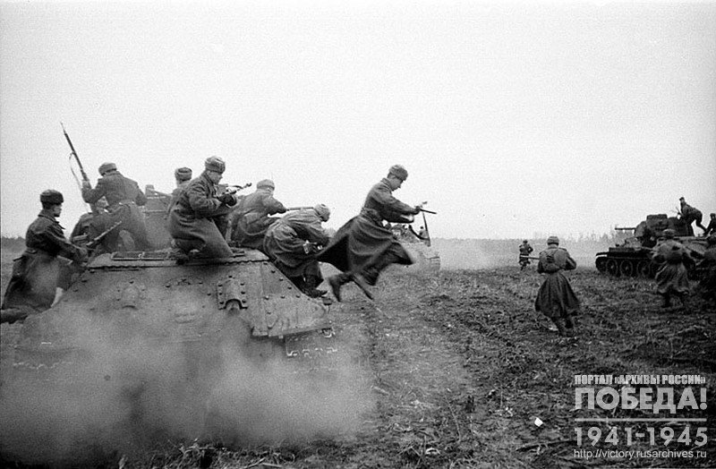Soviet tanks with submachine gunners bursting into enemy lines on the outskirts of Budapest