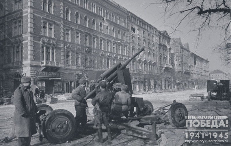 Soviet AA-crew firing at enemy aircraft in one of the streets of Budapest