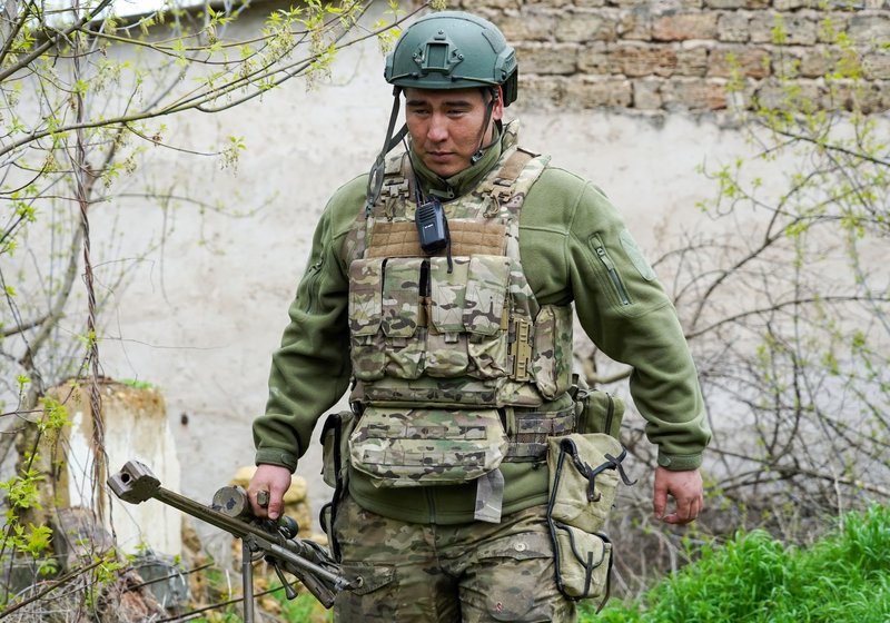 Airborne assault volunteer battalion "Sokol". Russia. Kherson region. Sniper of airborne assault volunteer battalion "Sokol" with call sign "Batyi" performing task of defending lines on the left bank of Dnieper river in Kherson region