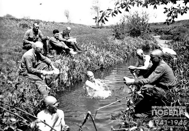 Soldiers bathe in a river after the battle