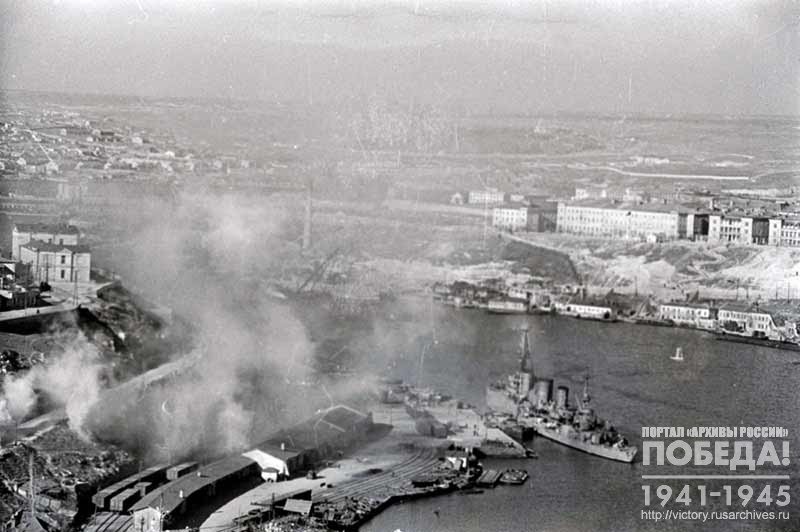 Warships set up a smoke screen on an air alarm signal in Sevastopol Harbor
