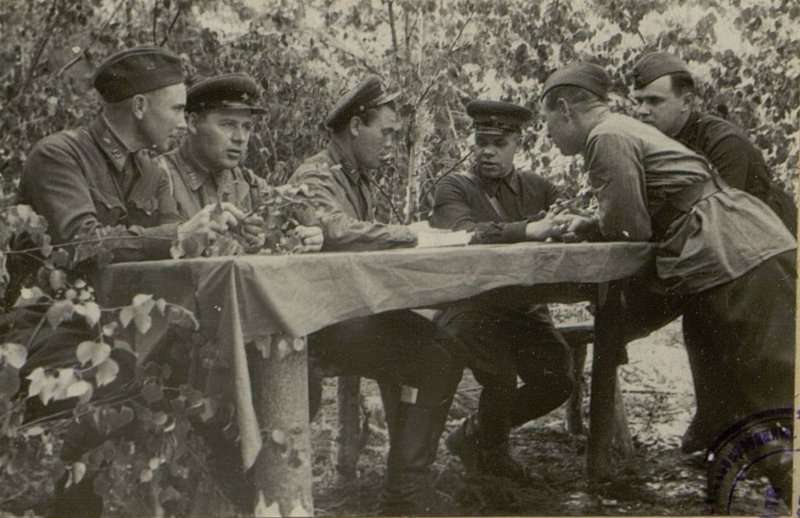 Image: Comrade Kholostov talks with the Command Staff about the progress of combat training