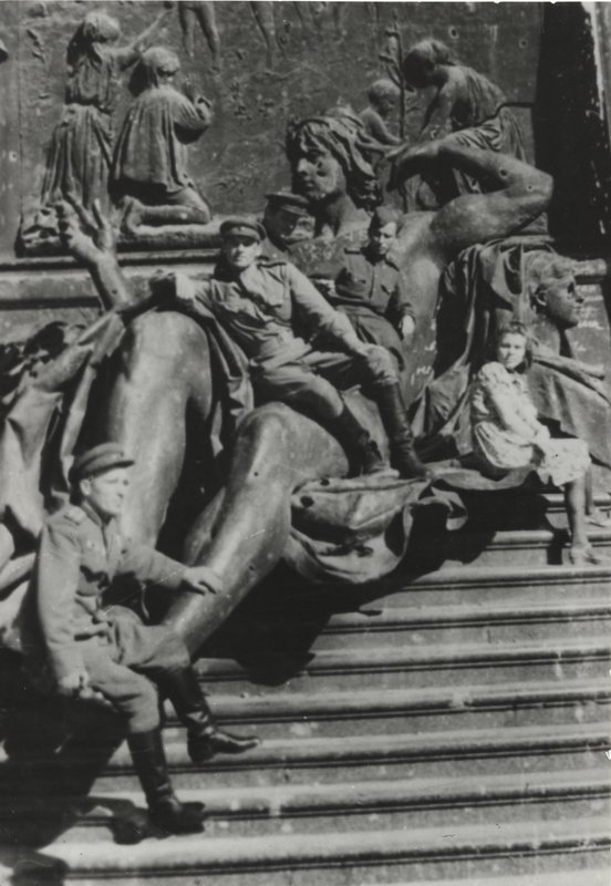 A group of Soviet servicemen on the steps of the Reichstag