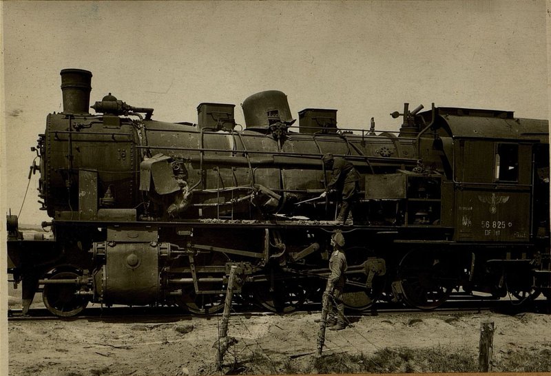 Image: Members of the commission are considering the breakdown of the bottom of the locomotive boiler from the direct hit by a rocket projectile