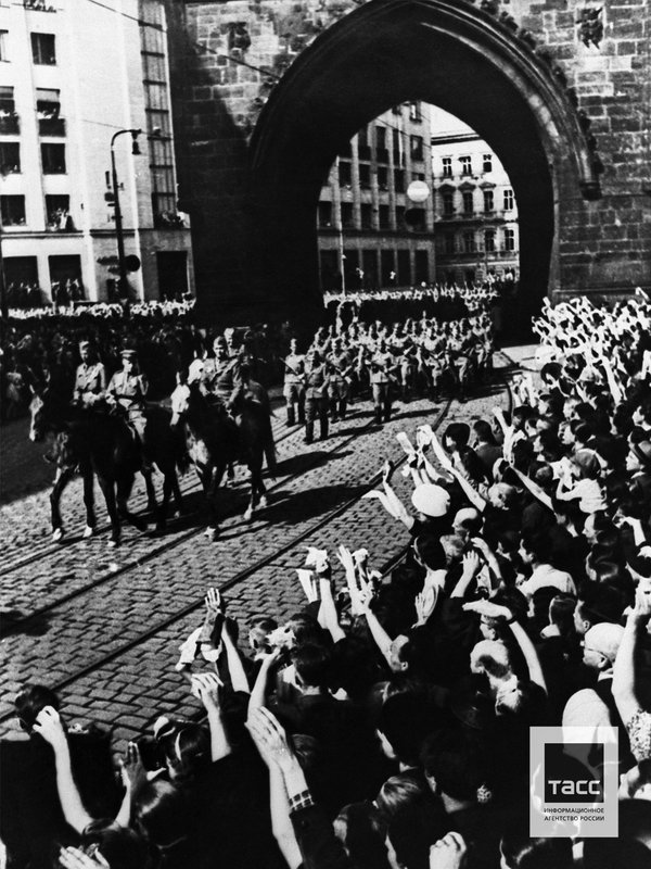 Residents during a meeting of Soviet soldiers who liberated the city from the German invaders. Prague, May 1945