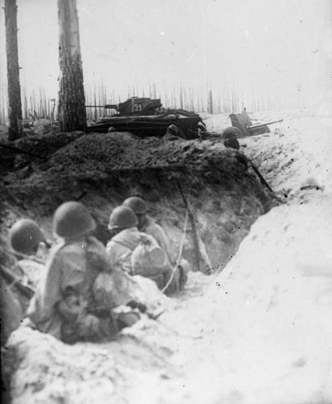 Four soldiers in the trench.