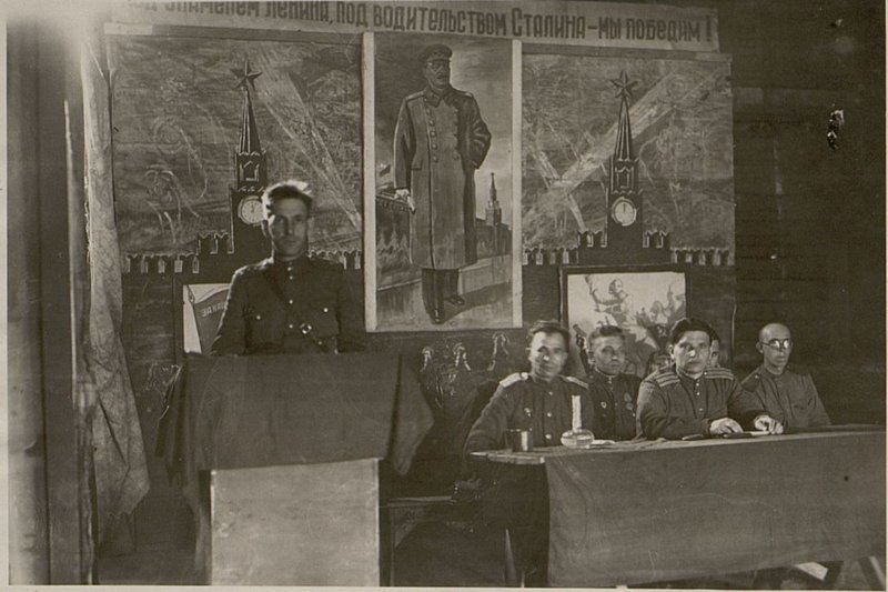 Image: At the Presidium of the same meeting. The head of the club, captain Lukyanov, makes a report on the Day of the Bolshevik Press
