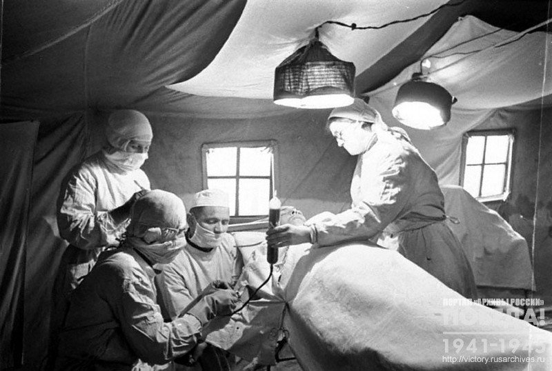 Blood transfusion to a wounded soldier in a field hospital of the active Red Army