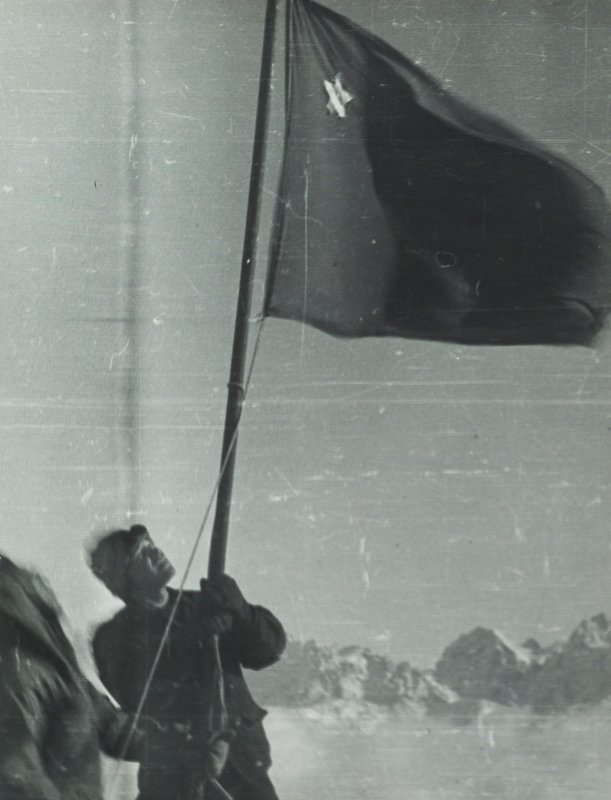 Lieutenant A.V. Bagrov and Lieutenant A. A. Nemchinov with the flag of the USSR on the summit of Elbrus