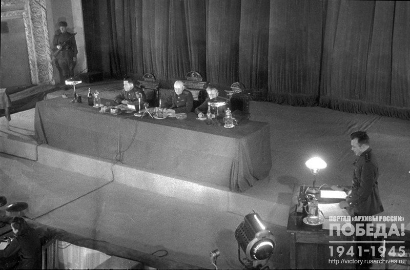 Secretary of Tribunal, Captain of Justice Kandybin reads the indictment at trial of German war criminals in Kharkov