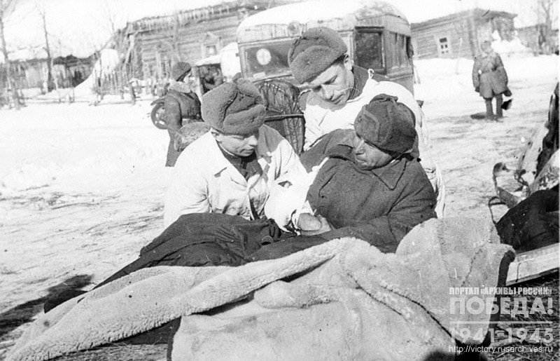 Combat medics receiving wounded soldiers