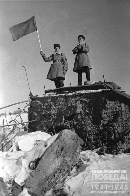 Soviet soldiers on a captured pillbox on the Karelian Isthmus