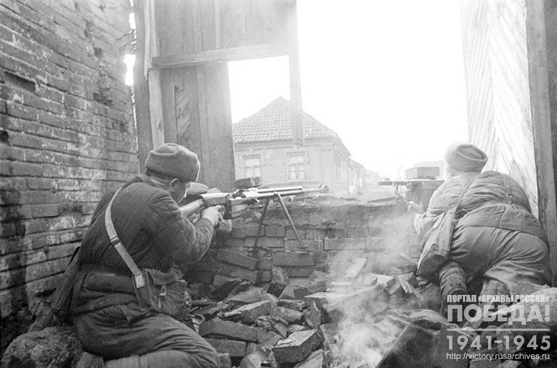 A group of submachine gunners is aiming fire. Crimea