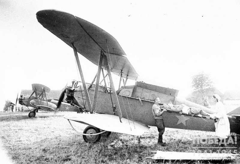 Embarkation of wounded soldiers aboard an ambulance aircraft