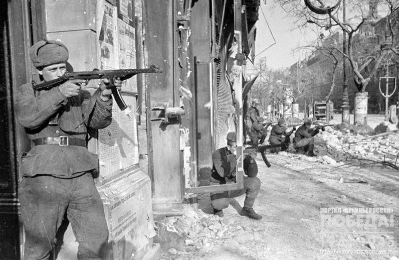 Soviet submachinegunners in combat in one of the streets of Budapest