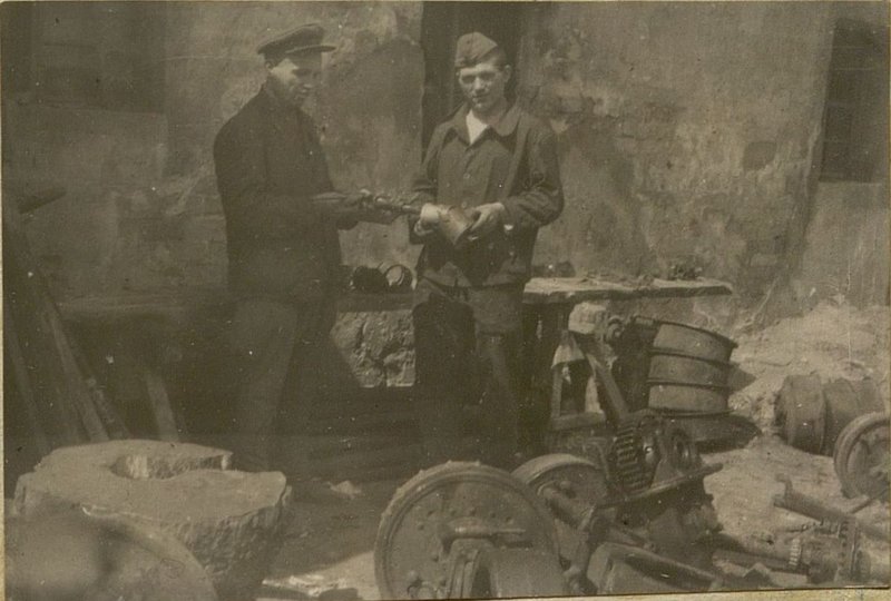 Image: The head of the auto repair shops Petty Officer Efimenko with the Red Army turner Shramko designed a device for boring pistons and piston rings of the GAZ-AA and ZIS-5 engines