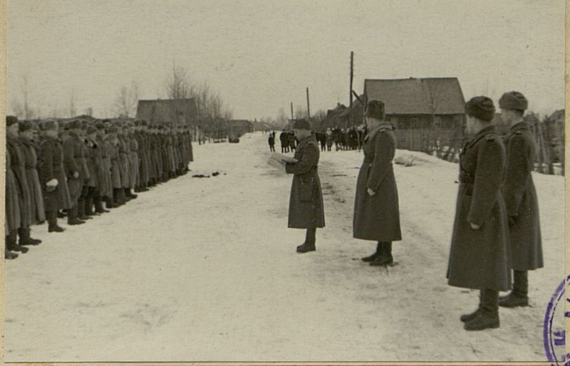 Image: Lieutenant Colonel Kiselev reads out the orders on awarding the brigade with the Order of the Red Banner and on assigning the name to the brigade - "Dnovskoy"