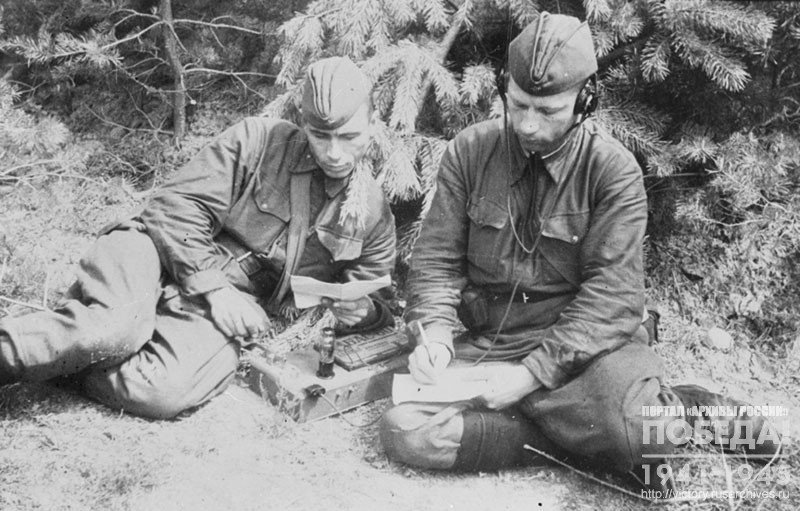 Senior radio operator Sergeant V. Anin teaches Private F. Samoylov to receipt a signal “by ear”