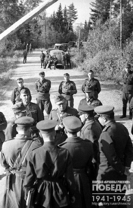Group of Soviet representatives  and Finnish command exchanging transfer protocols one of the sections of state border to Soviet command representatives by Finland