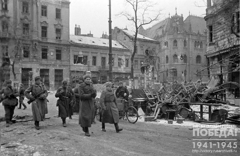Soviet soldiers passing through one of the blocks of Budapest that was liberated from Germans