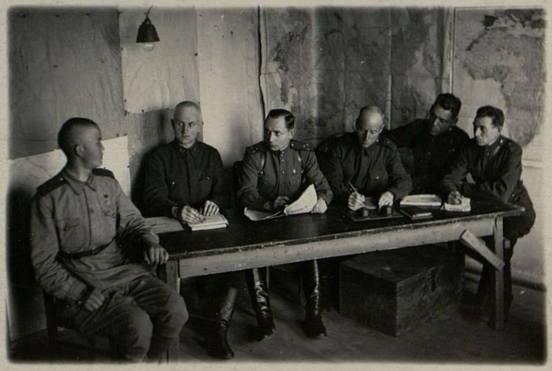 Image: The party commission of the brigade is considering the application of the Red Army soldier Baiganaev for admission to the candidate of the All-Union Communist Party of Bolsheviks