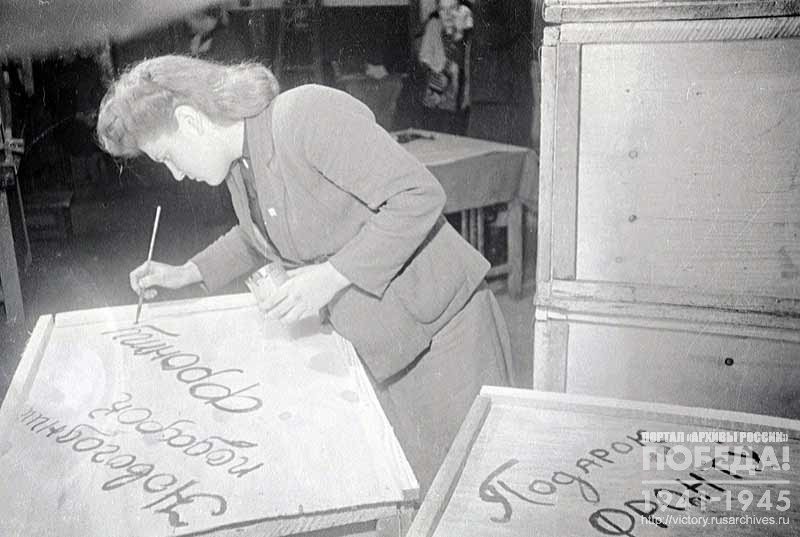 Preparing parcels with New Year's gifts for front line soldiers at one of the enterprises