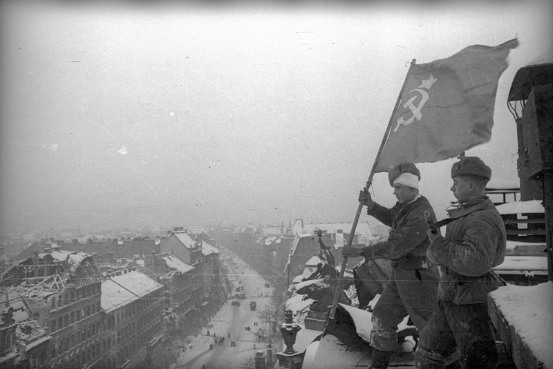 Soviet flag fluttering over Budapest on the roof of Parliament Building
