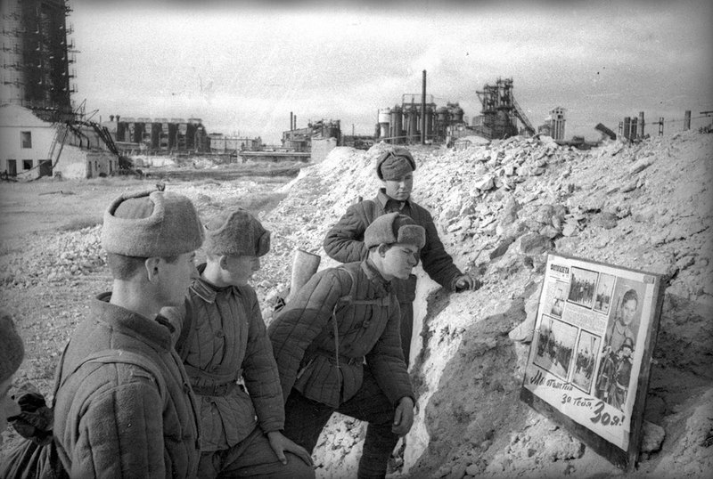 Newspaper with photos in a trench
