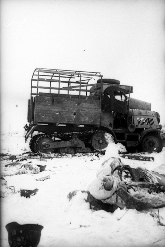 Knocked out enemy tracked towing vehicle and a killed driver at Kalinin Front.
