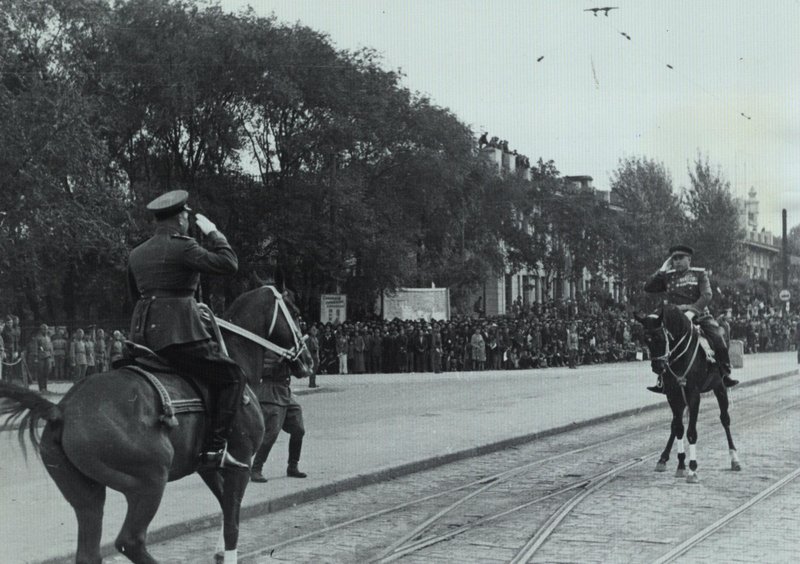 The Commander of the Harbin garrison, Colonel General A. Beloborodov (center) reviewing the parade of troops in honor of the victory over Japan