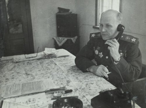 Маршал Советского Союза И.С. Конев (сидит за столом)