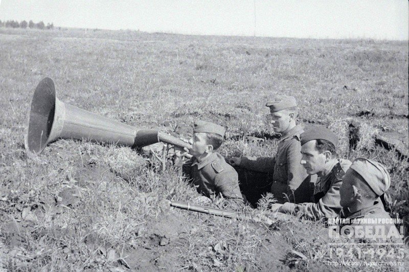 German POWs V. Olshansky and F. Tsapka with the help of a mouthpiece transmit a message to the soldiers of their unit about how they were received by the Russians