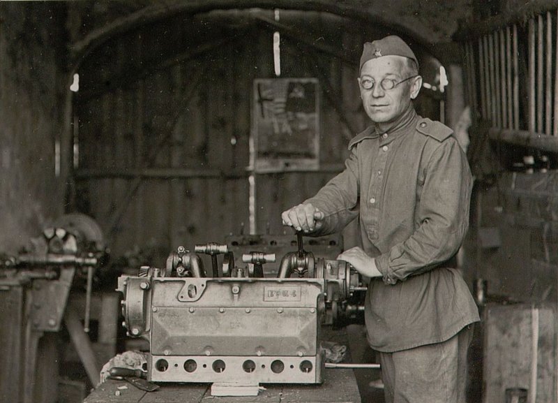 Image: 821 Aviation Service Battalion Private locksmith Oleinik Z.M. collects the motor. Complies with standards by 120-150%