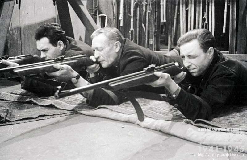 Vsevobuch fighters of the Chkalovskiy Agricultural Institute named after Andreev: A. Smirnov, Professor F. Lazarenko and F. Telegin on shooting training