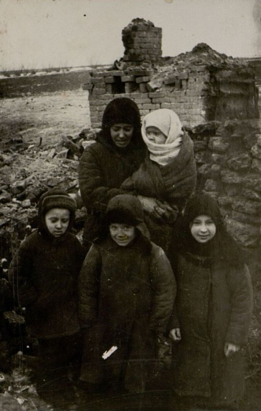 Image: At the ruined hearth. The family of a Red Army soldier I.P. Antonov from Novoselki, Oryol region