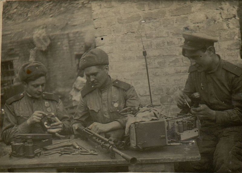 Image: Senior Sergeant Pluzhnikov is an optical master, Senior Sergeant Ryaguzov is a radio-telephone master and Corporal Salogub is a rifle master perfectly coped with the task of repairing artillery, radios, telephones and personal weapons of the soldiers, which provided the regiment with uninterrupted operation of artillery and weapons in the battles for the liberation of the Crimea.