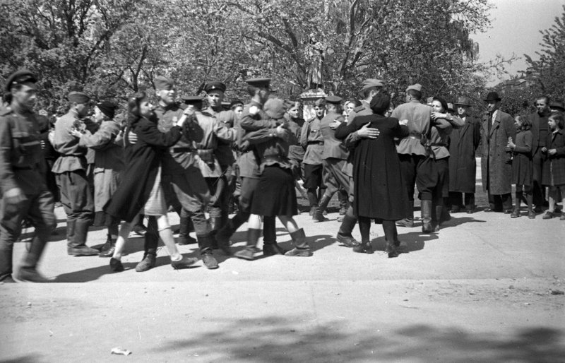 Soviet soldiers and officers dance on a street in Vienna celebrating the Victory over Nazi Germany
